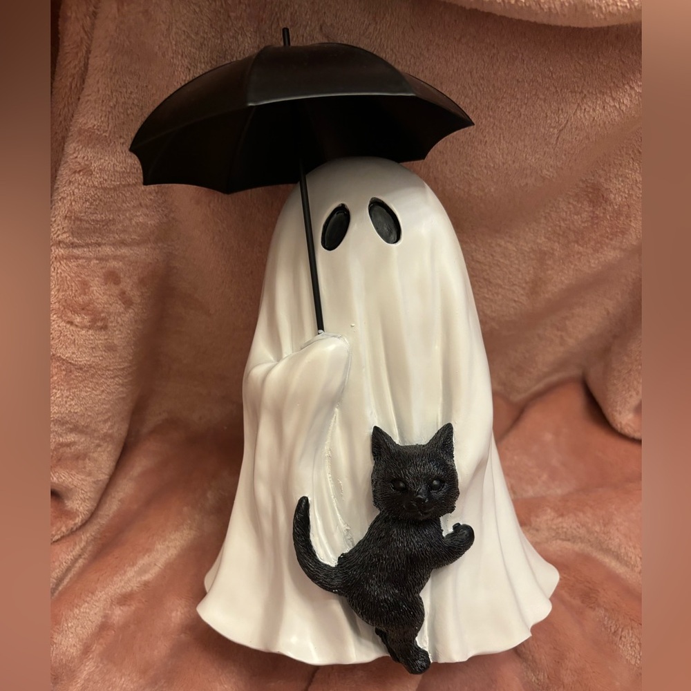 ghost with cat holding umbrella